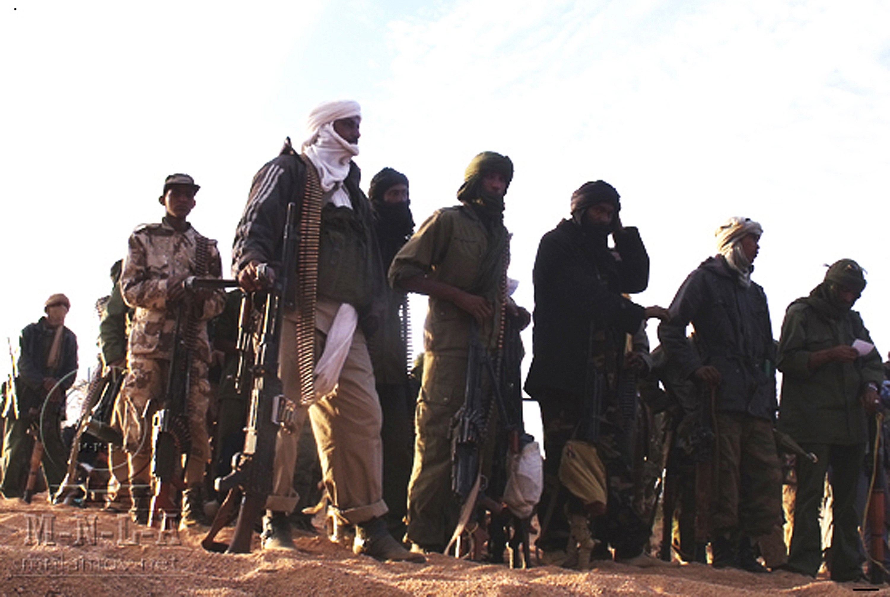 A handout picture released by the Mouvement national pour la libération de l'Azawad (Azawad National Liberation Movement - MLNA) on April 2, 2012 and taken in February 2012 reportedly shows MNLA fighters gathering in an undisclosed location in Mali. Islamist and Tuareg rebels clashed in the key town of Gao in Mali's occupied north, leaving at least 20 people dead, witnesses said on June 27, 2012. " RESTRICTED TO EDITORIAL USE - MANDATORY CREDIT "AFP PHOTO / MNLA "- NO MARKETING NO ADVERTISING CAMPAIGNS - DISTRIBUTED AS A SERVICE TO CLIENTS