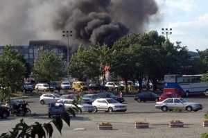 A picture shows smoke rising over Bourgas airport on 18 July. Three people were killed and more than 20 wounded in a bomb attack on a bus packed with Israeli passengers at a Bulgarian airport