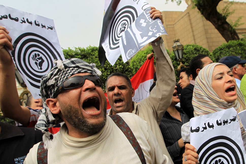 Activists from the April 6 Youth Movement shout anti-government slogans in downtown Cairo (Photo: KHALED DESOUKI/AFP)