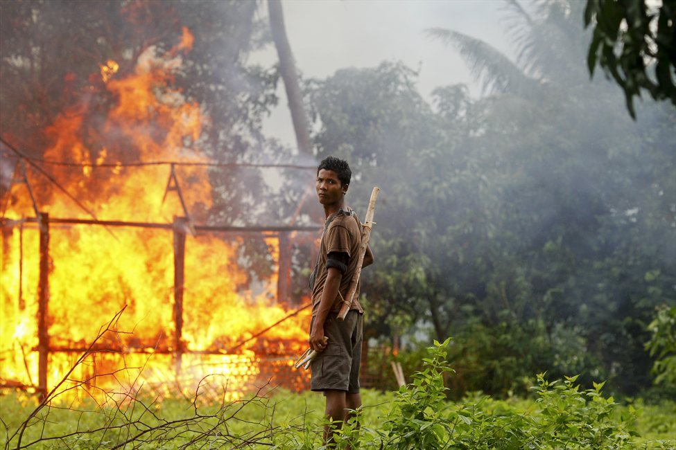 A Rohingya Muslim village burns in recent violence in Myanmar