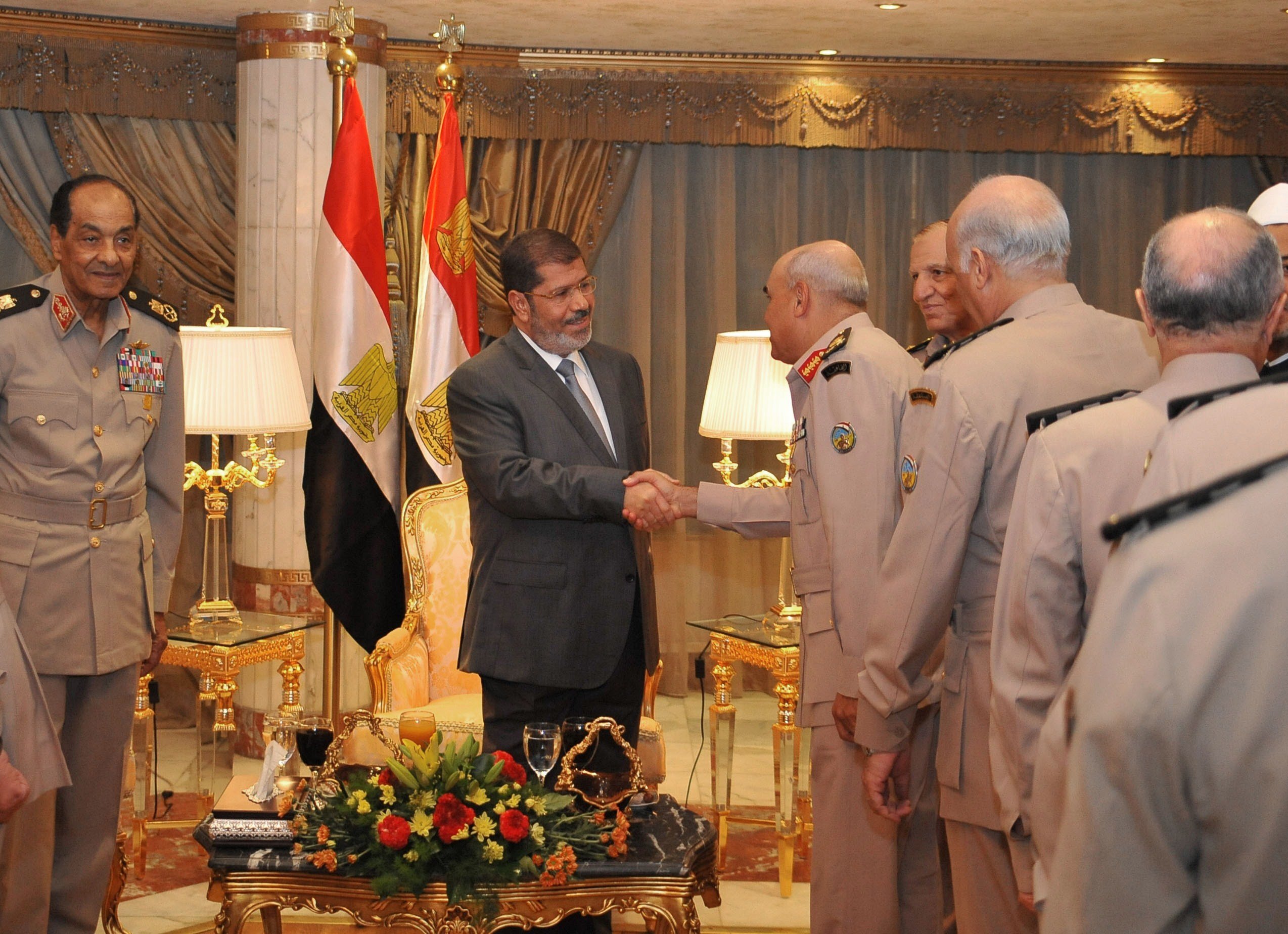 This handout picture released by the Egyptian presidency shows Egyptian President Mohamed Mursi (C) meeting with Field Marshal Hussein Tantawi (L), Egyptian Armed Forces Chief Of Staff Sami Anan (2nd R) and members of the Egyptian Supreme Council of Armed forces ahead of an Iftar meal ceremony at the Al-Jalaa military club in Cairo on July 29, 2012 (photo: AFP /HO/EGYPTIAN PRESIDENCY)