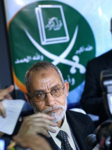 Egypt's Muslim Brotherhood Mohamed Badie looks on under the group's logo during his first press conference in Cairo, Egypt, Saturday, Jan. 16, 2010 (AP Photo/Amr Nabil)
