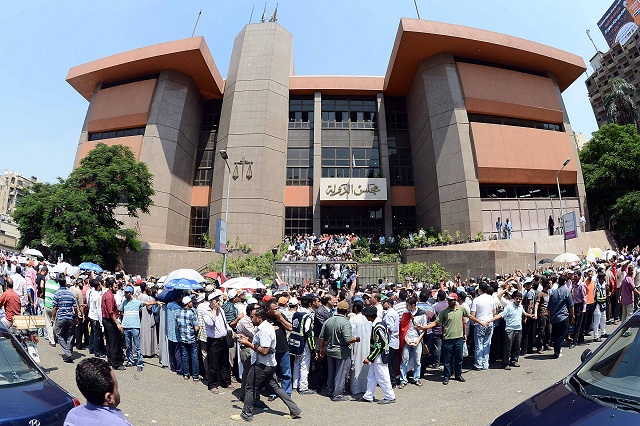Crowd gather outside the Administrative Judiciary Court in Cairo where a critical ruling on Tuesday may result in the dissolution of the Constituent Assembly (photo: Mohamed Omar)