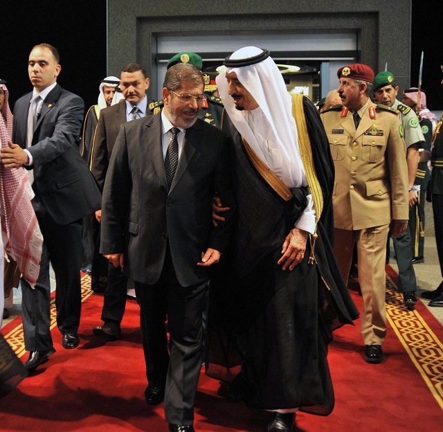 A picture released by the Egyptian Presidency shows Saudi Arabia Crown Prince Salman Bin Abdulaziz al-Saud (R) greeting Egyptian President Mohamed Morsy upon his arrival in Jeddah on 11 July (AFP PHOTO / AHMED FUAD)