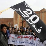 A Moroccan protester waves the February 20 movement flag at a protest in Morocco (AFP/ Joseph Eid)  