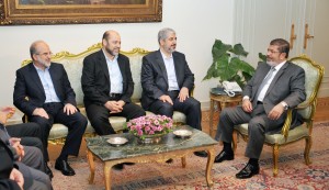 A handout picture released by the Egyptian presidency shows Egyptian President Mohamed Morsy (R) meeting with Palestinian Hamas political bureau chief Khaled Misha'al (2nd R) at the presidential palace in Cairo on 19 July 19 2012 (photo: AFP PHOTO/EGYPTIAN PRESIDENCY)