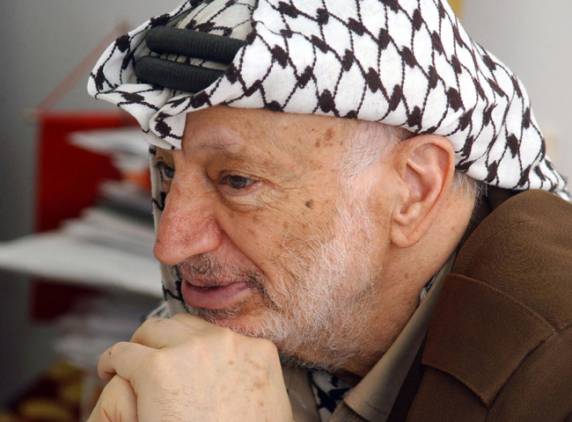 Palestinian leader Yasser Arafat at his office in the West Bank city of Ramallah (AFP file photo)