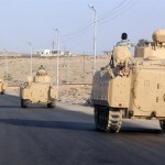 A convoy of Egyptian armoured vehicles head along a road in El-Arish on the Sinai Peninsula on the way to the city of Rafah near the Gaza border (File photo AFP)