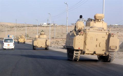 A convoy of Egyptian armoured vehicles head along a road in El-Arish on the Sinai Peninsula on the way to the city of Rafah near the Gaza border (File photo AFP)