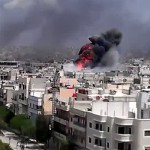 Smoke billows from sites of shelling in Homs (Photo: AFP/YOUTUBE)
