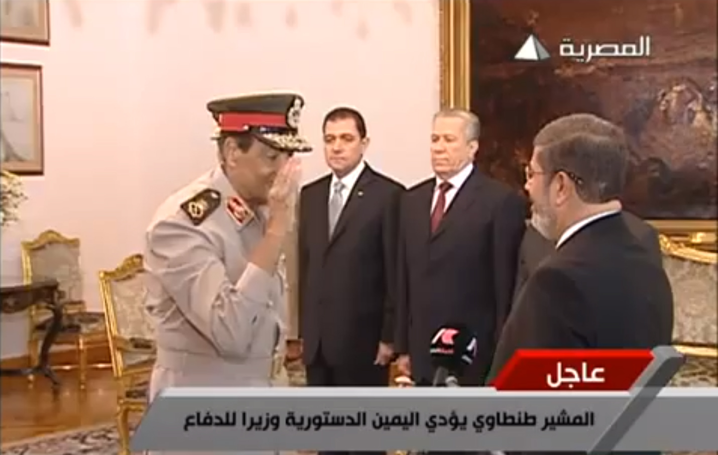 Field Marshall and Defence Minister Mohamed Tantawi salutes President Mohamed Morsy during the presidential oath swearing ceremony televised on the state run Al-Masrya channel, 30 June SCREEN GRAB / AL-MASRYA