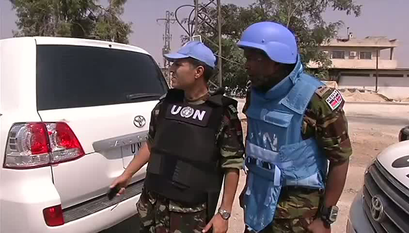 : An image grab taken from a video released by the United Nations Supervision Mission in Syria (UNSMIS) shows members of the UN Supervision Mission in Syria during a tour of the central Syrian cities of Homs and Rastan on 29 July 2012 (photo: AFP / HO / UNSMIS)
