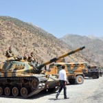 Heavy armoured vehicles of Turkish military are stationed in front of Gecimli military outpost where Kurdish rebels attacked and killed 6 soldiers and 2 village guard on 5 August AFP PHOTO/STR