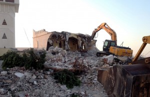 Libyan Islamist hardliners use a bulldozer to raze the mausoleum of Al-Shaab Al-Dahman near the centre of Tripoli on 25 August AFP PHOTO / MAHMUD TURKIA