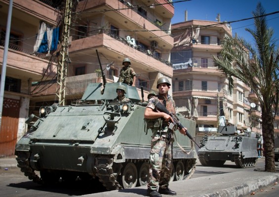 Lebanese army commandos stand on armoured personnel carriers in the Lebanese northern port city of Tripoli on 23 August AFP PHOTO / SAM TARLING
