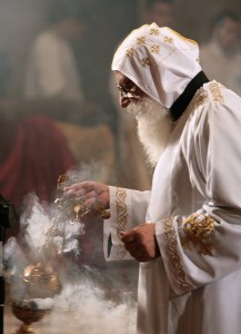 An Egyptian Copt monk burns incense prior to the Coptic Easter celebration mass (File photo) AFP PHOTO / CRIS BOURONCLE 