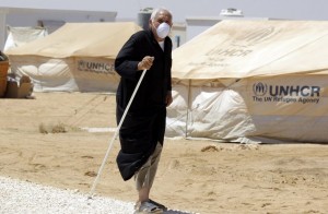 A Syrian refugee walks after undergoing a medical check at a Moroccan military field hospital in the Zaatari camp for Syrian refugees, 15 kilometres (nine miles) from the kingdom's northern city of Mafraq, near the border with Syria, on August 11, 2012. AFP PHOTO/KHALIL MAZRAAWI