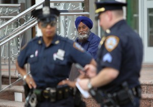 Police increase their presence at the Sikh Cultural Center in Richmond Hill Queens in New York on 6 August AFP PHOTOS / Mehdi Taamallah 