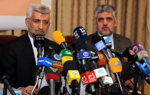 Saeed Jalili, head of Iran's supreme national defence council, holds a joint press conference with Iranian ambassador to Syria Mohammad Reza Sheibani (L) at the Iranian embassy in the Syrian capital Damascus on 7 August (AFP PHOTO/STR)
