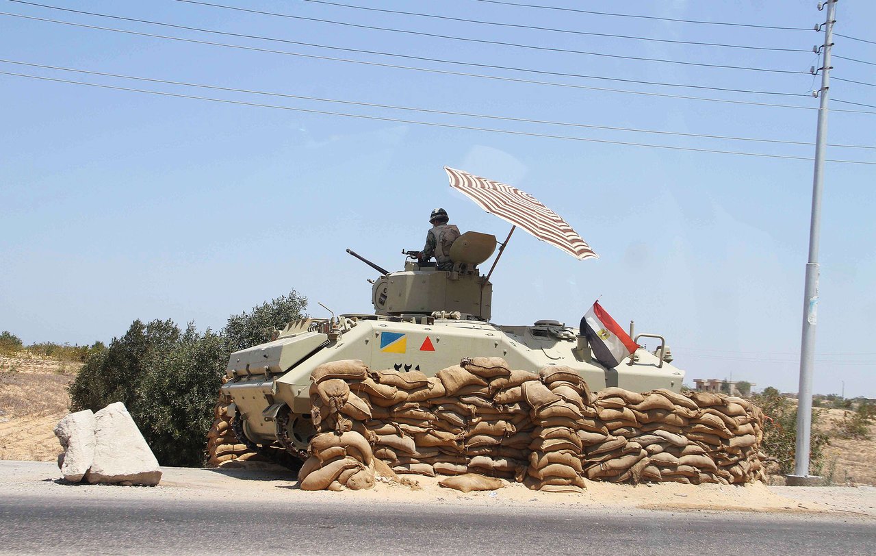 An Egyptian army vehicle keeps its position close to the Rafah border crossing with the Hamas-run Gaza Strip on August 06, 2012. AFP PHOTO/AHMED MAHMOUD