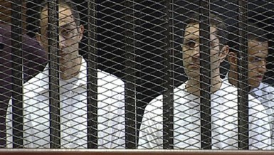 Gamal (left) and Alaa Mubarak during their trial in Cairo on 2 June 2012 (File photo) AFP