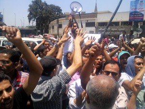 Cleopatra ceramics workers protest outside of the presidential palace on 6 July after Mohamed Morsi was declared winner of the presidential elections (Mohamed Omar )