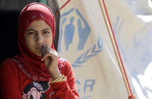 Refugee waits in a camp on the Jordan side of the border with Syria AFP PHOTO / KHALIL MAZRAAWI