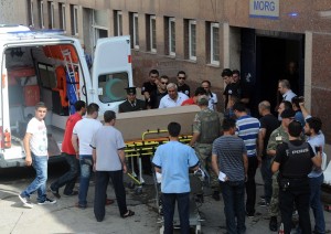 Turkish soldiers and medics unload the coffin of a slain Turkish soldier to a hospital in Beytussebap on 3 September. Kurdish rebels wielding rocket launchers and machine-guns attacked a security base in southeast Turkey, triggering a firefight that left 30 people dead AFP PHOTO 