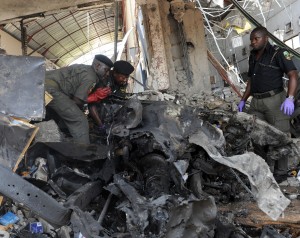 Bomb squad police work at the office of This Day newspaper, the radical sect Boko Haram said it carried out the attacks (File photo)  AFP PHOTO / PIUS UTOMI EKPEI