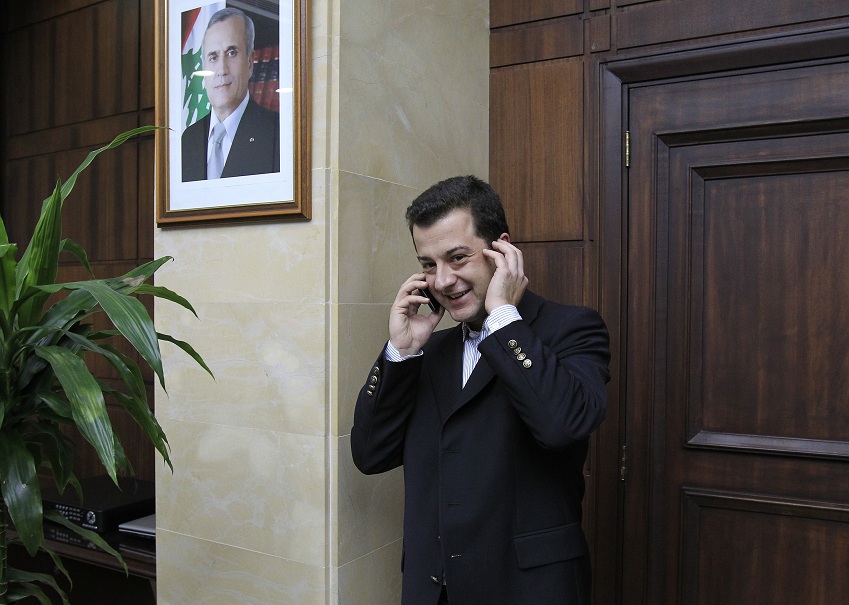 Turkish national Aydin Tufan Tekin phones after being handed to the Turkish Ambassador to Lebanon at the Lebanese General Security headquarters in Beirut on 11 September AFP PHOTO / ANWAR AMRO