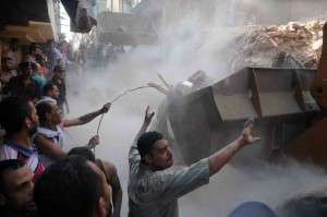 Workers begin to clear the rubble from the collapsed apartment building in the Shubra district of Cairo  Mohamed Omar