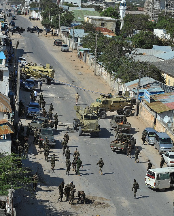 Somalia policemen gather at the area of a bomb blast at the Jazeera hotel compound where the newly elected Somali president Hasan Sheikh Mahmud was staying, in Mogadishu AFP PHOTO/SIMON MAINA