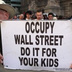 A protester with 'Occupy Wall Street' holds up a sign during demonstrations in New York City. The 'Occupy Wall Street' movement, which sparked international protests and sympathy for its critique of the global financial crisis, is commemorating the first anniversary of its earliest protest. AFP PHOTO / Spencer Platt
