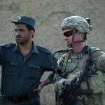 US Army Lieutenant Jameson Bligh looks on as he consults with a member of the Afghan National Police during a joint patrol in Kandahar province (File photo) AFP PHOTO / TONY KARUMBA