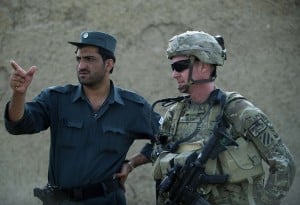 US Army Lieutenant Jameson Bligh looks on as he consults with a member of the Afghan National Police during a joint patrol in Kandahar province (File photo)  AFP PHOTO / TONY KARUMBA