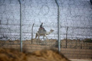 An Egyptian soldier rides a camel while patrolling the Israeli border with Egypt (File photo)  AFP PHOTO / MENAHEM KAHANA