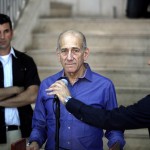 Former Israeli prime minister Ehud Olmert speaks to the press following a sentence hearing in his corruption case at Jerusalem's District Court AFP PHOTO / GALI TIBBON