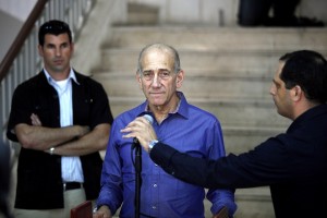 Former Israeli prime minister Ehud Olmert speaks to the press following a sentence hearing in his corruption case at Jerusalem's District Court  AFP PHOTO / GALI TIBBON