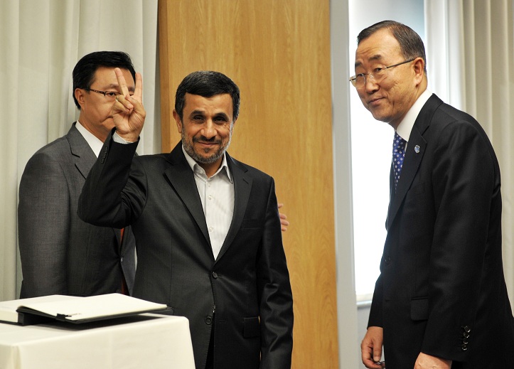 President of Iran Mahmoud Ahmadinejad greets the media after signing a guest book with United Nations Secretary General Ban Ki-Moon before their meeting at UN headquarters in New York AFP PHOTO / STAN HONDA