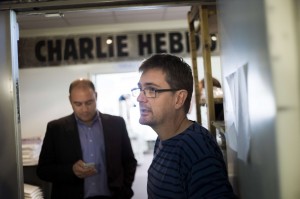 French satirical weekly Charlie Hebdo's publisher, known only as Charb, speaks to journalists on 19 September at the Paris headquarters of the magazine AFP PHOTO / FRED DUFOUR