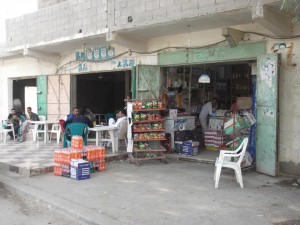 Mamdouh Nasif reopens his shop after it was shot at by gunmen Nasser El-Azazy