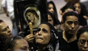 Coptic Egyptians attend a service at the Abbassiya cathedral in Cairo on October 12, 2011 to mourn those killed during recent clashes with security forces   AFP PHOTO/MAHMUD HAMS