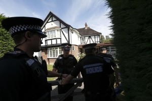 British police officers arrive at a residential address believed to be the British home of the Hilli family shot dead in their car in the French Alps in Claygate, in south-east England  AFP PHOTO / JUSTIN TALLIS