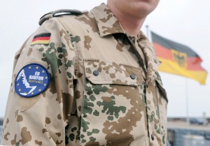 Badge on the uniform of a German marine reads "EU NAVFOR Somalia", an Italian naval helicopter serving as a part of the mission drew small arms fire off the Somali coast   AFP PHOTO / INGO WAGNER