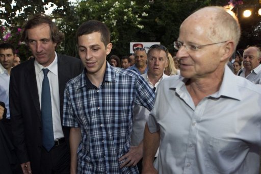 French ambassador to Israel Christophe Bigot (L), recently-freed Israeli soldier Gilad Shalit (C) and his father Noam AFP/File, Jack Guez
