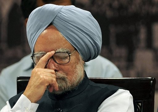 Indian Premier Manmohan Singh said he acted in the national interest to stop "a loss of support in our economy" AFP Photo / Punit Paranjpe