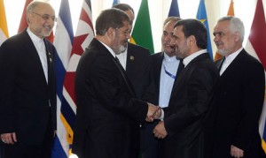 The idea of using Islam as a basis for ruling Egypt was one of the major talking points during the drafting of Egypt’s new constitution. Members of the constituent assembly questioned the wording of Article 2 of Egypt’s constitution Picture: President Mohamed Morsi (2nd from L) met Iranian President Mahmoud Ahmadinejad at the Tehran summit of Non-Aligned nations.(File Photo) (AFP Photo)