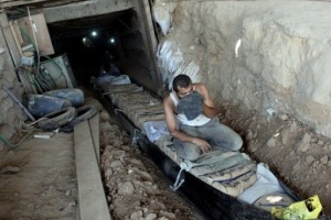 Palestinians transport bags of cement through smuggling tunnels under the Gaza-Egypt border in Rafah  AFP, Mohammed Abed