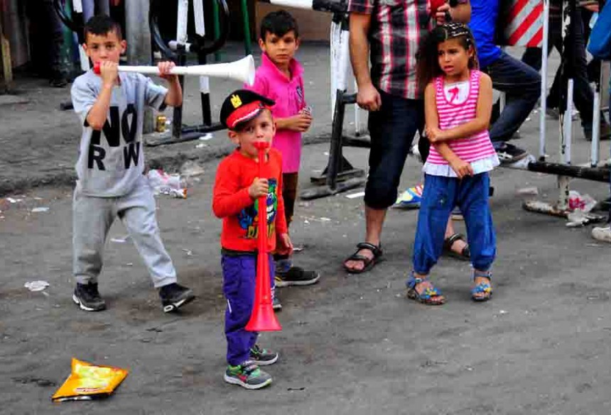 Children play in their new clothes during celebrations for Eid Al-Adha (Photo by Hassan Ibrahim)