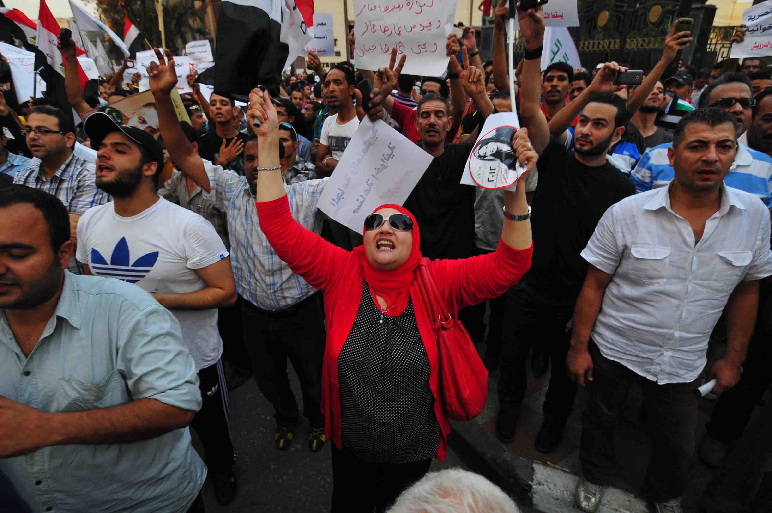 A female protester shouts during Friday’s demonstrations. (Photo by Hassan Ibrahim)